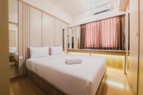 Spacious and Homey 2BR at Sky House BSD Apartment By Travelio